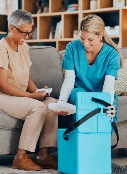 Doctor, senior woman and home with medicine, box or delivery for healthcare, wellness or consulting.